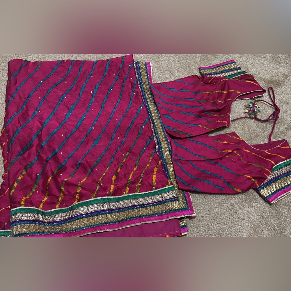 Vibrant Pink and Blue Saree with Gold Accents